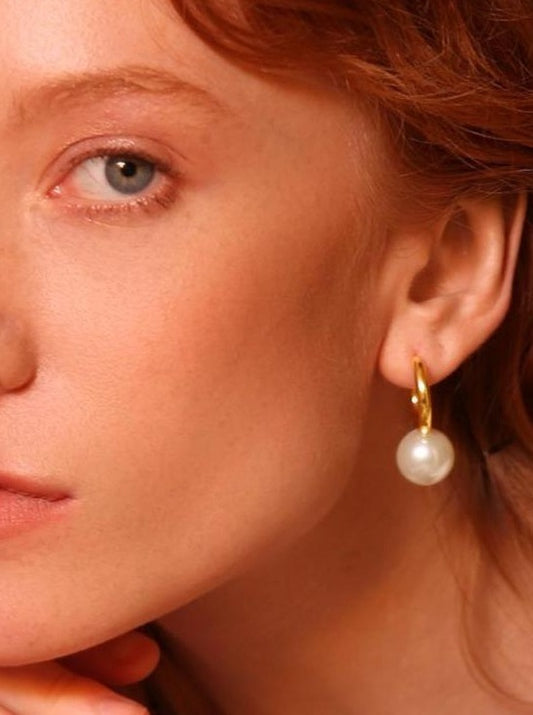 Redheaded woman with hoop earring