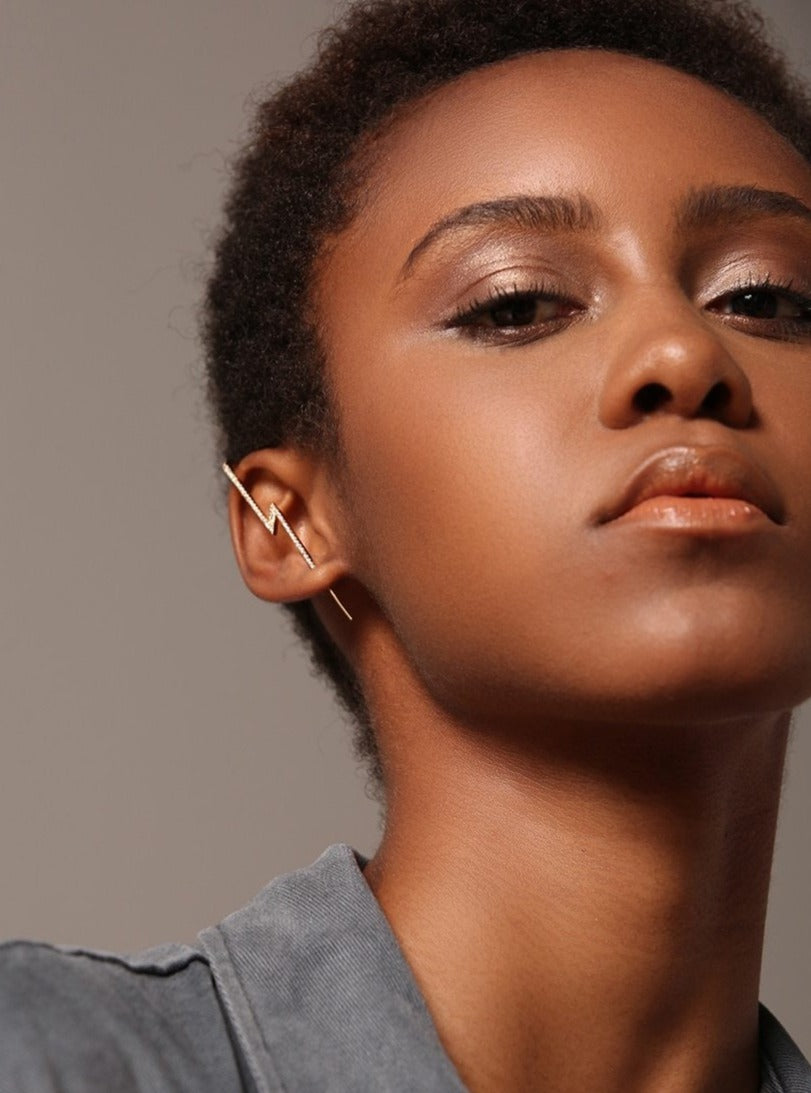 dark skin girl wearing ear cuff 